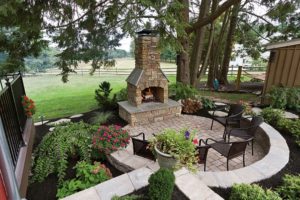 Exterior Chimney decor stone with metal chairs